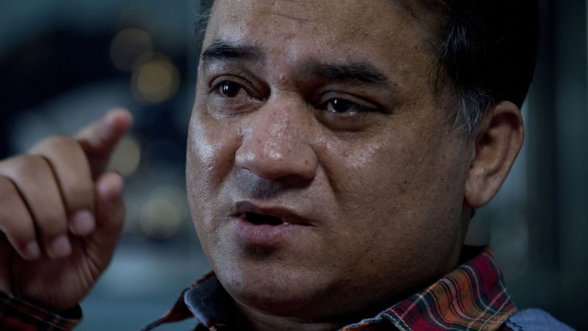 In this Feb. 4, 2013 photo, Ilham Tohti, an outspoken scholar of China's Turkic Uighur ethnic minority, speaks during an interview at his home in Beijing, China. Tohti was set to go on trial on Wednesday, Sept. 17, 2014 on separatism charges in the country's far western region of Xinjiang. (AP Photo/Andy Wong)