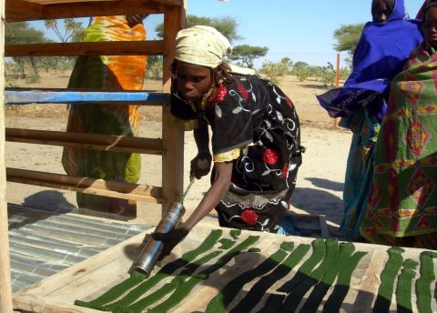 Pictured, a lake community in Chad dries-out the algae spirulina for consumption. The high-protein cyanobacterium is used by many populations, is now common in health food supplements and can be grown in space for use in meals.