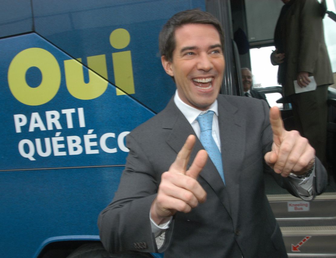 Then-leader of the separatist Parti Quebecois, Andre Boisclair boards his campaign bus after voting in 2007 as Quebec's voters decide on a new government. 