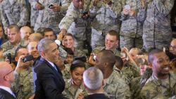 President Barack Obama reaches into the crowd to greet members of the military after speaking at US Central Command (CentCom) at MacDill Air Force Base, Fla., Wednesday, Sept. 17, 2014.
