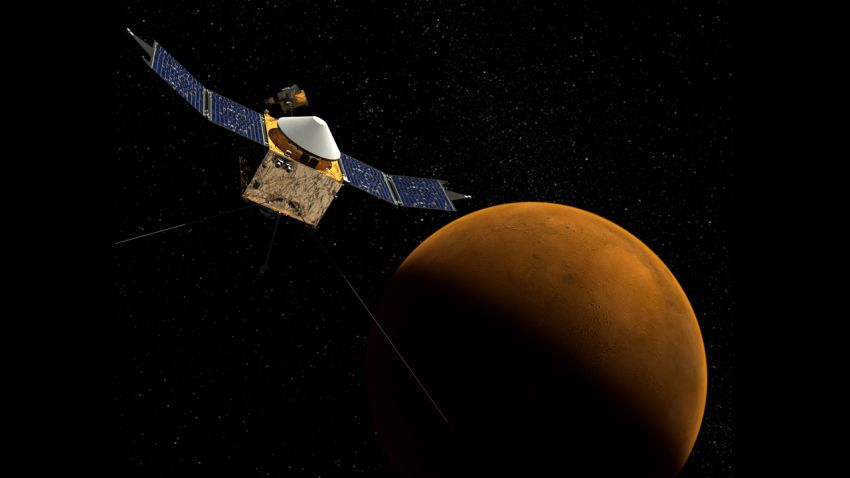 This artist's concept shows the MAVEN spacecraft with the planet Mars in the background.