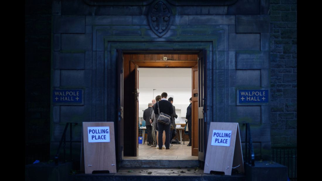 People wait to cast ballots inside a polling station in Edinburgh on September 18.