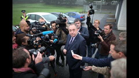 Salmond chats with reporters after casting his vote September 18 in Strichen, Scotland.