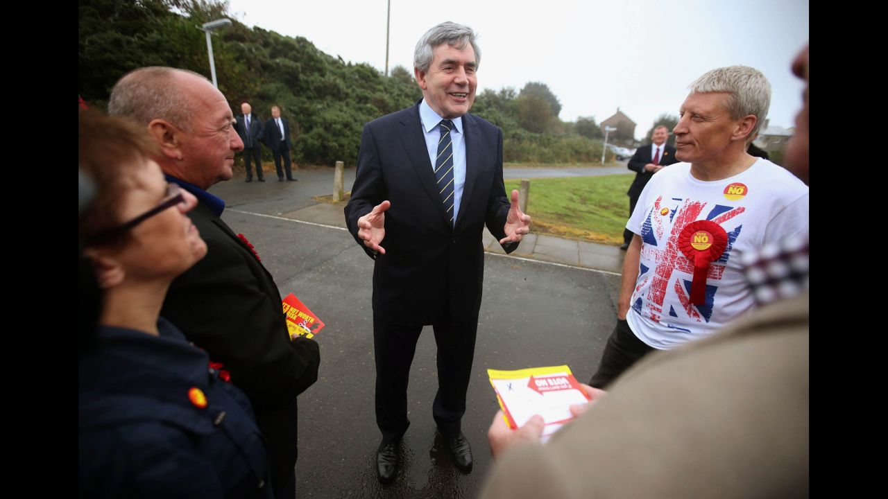 Former British Prime Minister Gordon Brown talks to pro-union campaigners outside a polling station in Queensferry, Scotland, on September 18.