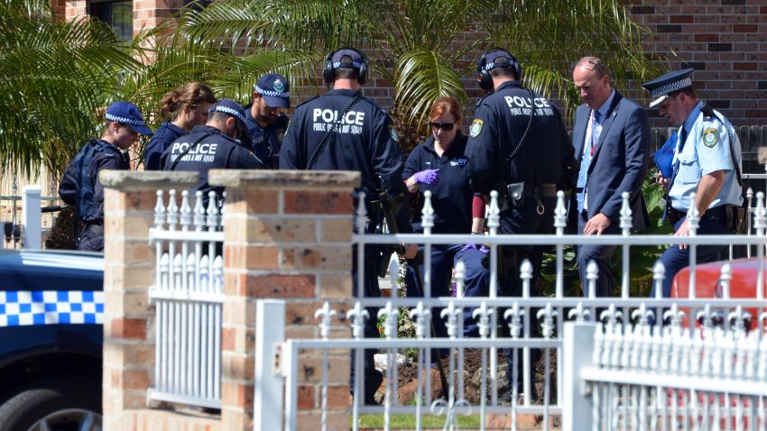 Forensic experts collect evidence from a house in the Guildford area of Sydney on September 18, 2014. Australia's largest ever counter-terrorism raids detained 15 people and disrupted plans to "commit violent acts", including against random members of the public that reportedly involved a beheading on camera. AFP PHOTO / Saeed Khan        (Photo credit should read SAEED KHAN/AFP/Getty Images)