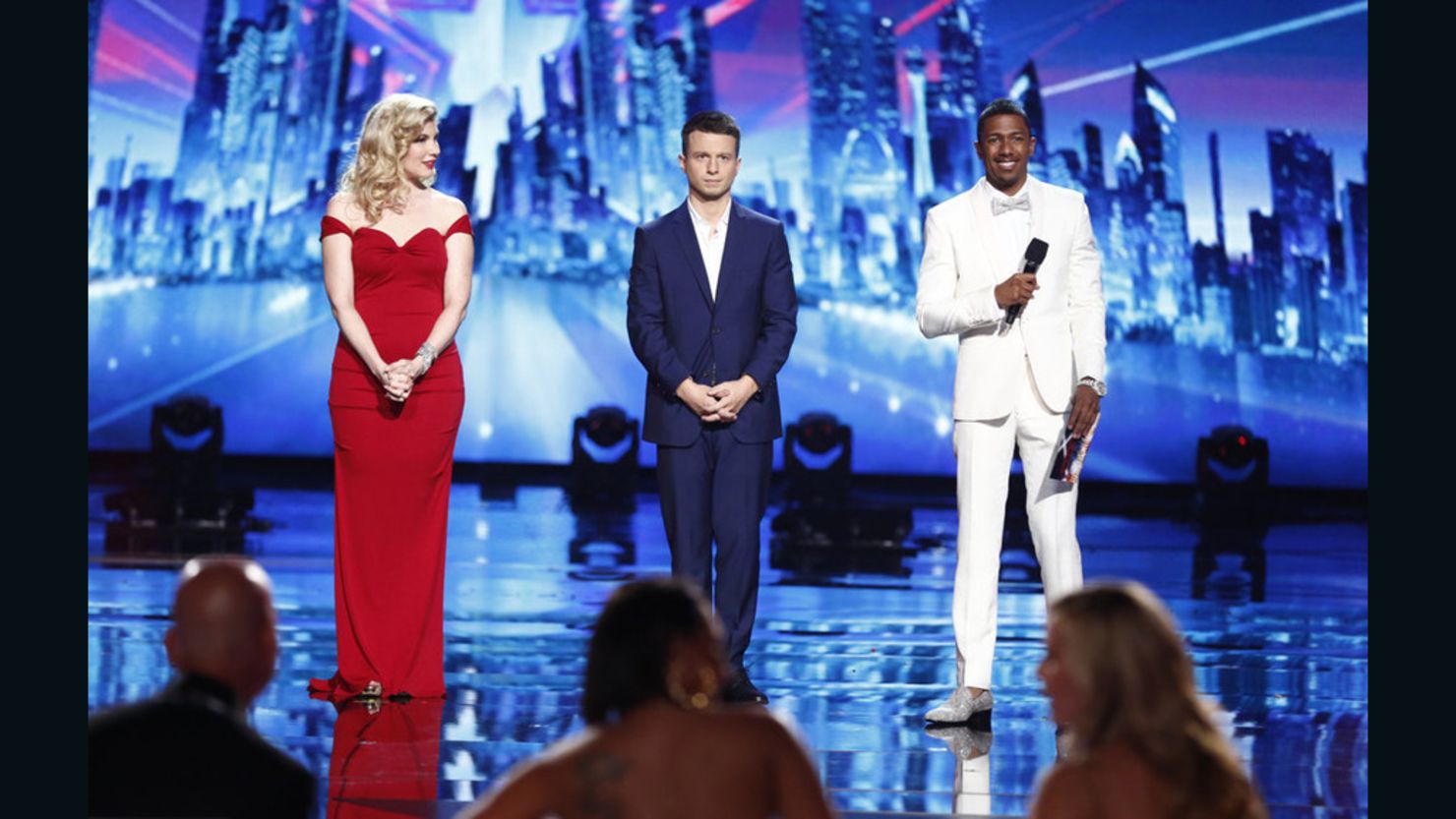 "America's Got Talent" contestants Emily West and Mat Franco, center, join host Nick Cannon during Wednesday's finale.