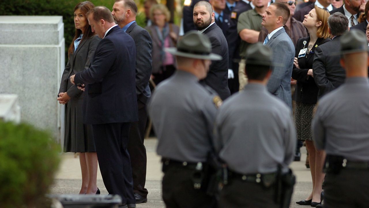 Pennsylvania Attorney General Kathleen Kane, left, prepares to enter the Rotunda at Marywood University for the viewing of Dickson's body.