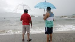 Caption:Two men observe the step of the Tropical Storm Polo in Acapulco, Guerrero State, Mexico on September 17, 2014. The storm swirled off the southwestern coast and was expected to become a hurricane late Wednesday or early Thursday, the US forecasters said. AFP PHOTO/Pedro Pardo (Photo credit should read Pedro PARDO/AFP/Getty Images)
