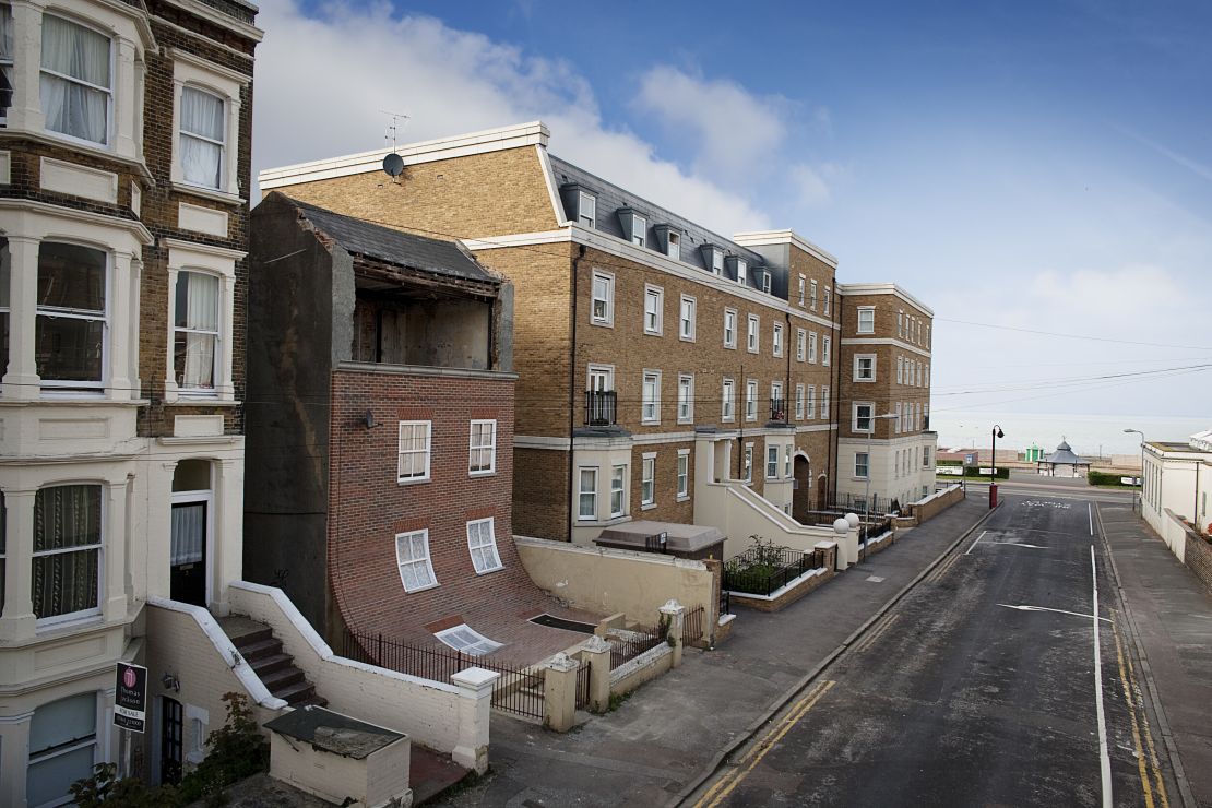 The "Sliding House" by artist Alex Chinneck, known for his playful experiments with our perception of architecture.
