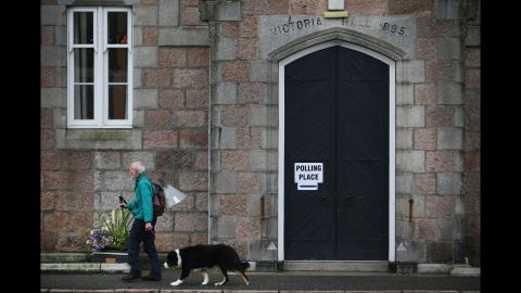 A man walks to a polling station to cast his vote in Ballater, Scotland, on September 18.
