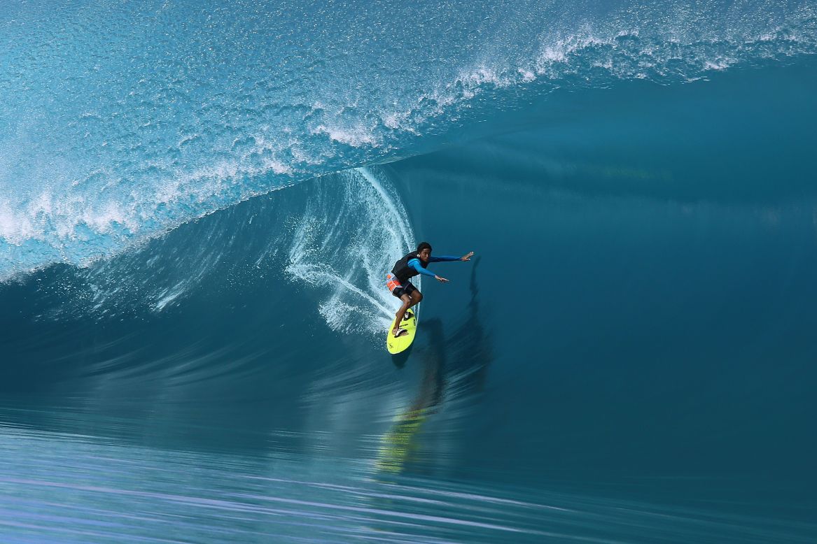 Local 17-year-old surfer Matahi Drollet shows his skills during the filming in the Hava'e pass in Teahupoo. 