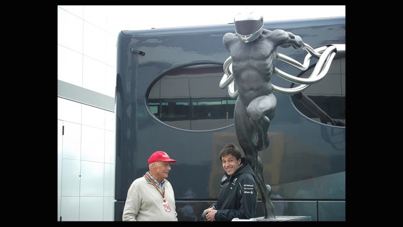 F1 art can be functional too as Mercedes chiefs  Niki Lauda and Toto Wolff find out as they hang out under the 1carus statue which was unveiled at the 2014 British Grand Prix.