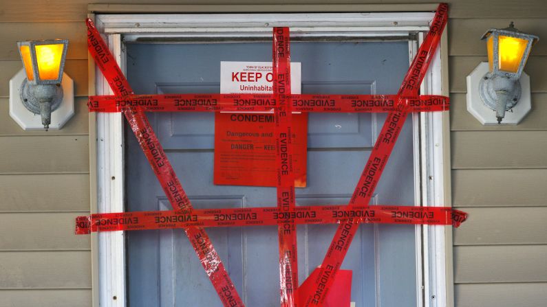 Evidence tape and a "condemned" sign hang over the door of a Blackstone, Massachusetts, home on Friday, September 12. The bodies of <a href="http://www.cnn.com/2014/09/13/justice/massachusetts-dead-infants/index.html">three dead infants were found in the home,</a> which was so squalid that police officers had to search it in hazmat suits.