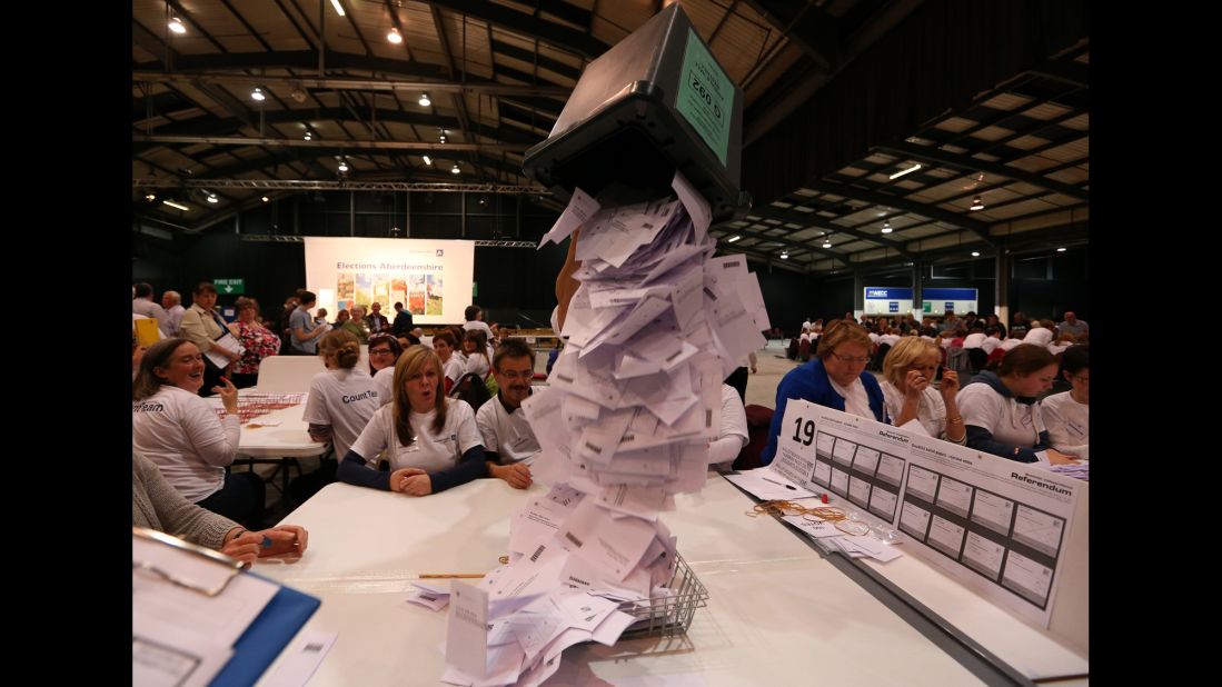 Ballot boxes are opened as counting begins Thursday, September 18, in Aberdeen, Scotland.