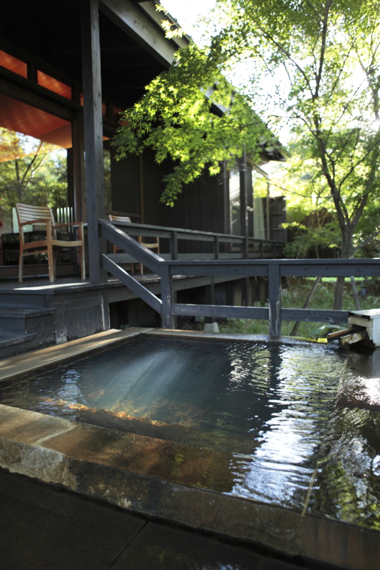Bathing in hot spring water is an essential part of staying at a Japanese inn, and Hoshino Resorts KAI Aso makes it spectacular. Every villa on the six-and-a-half-acre property has a private outdoor tub on a terrace jutting into the surrounding forest.