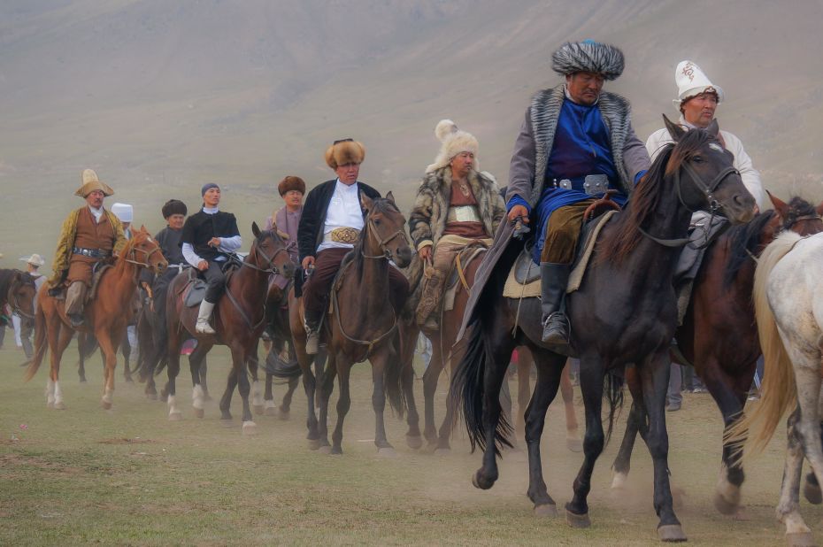 Kyrgyz dressed in traditional attire and rode horses, reenacting the lives of nomadic people.