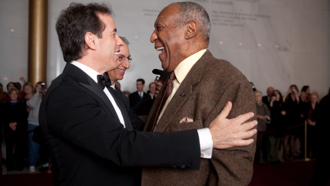 Cosby and comedian Jerry Seinfeld embrace in 2009 at the annual awarding of the Mark Twain Prize for American Humor. Cosby declined the prize twice before accepting. His mother read Twain to him as a child -- a huge influence on his storytelling.