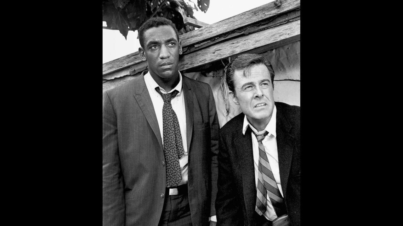 Cosby won three Emmys for his portrayal of Alexander Scott, an Oxford-educated spy who travels undercover with his tennis-playing partner, Kelly Robinson (Robert Culp) in "I Spy," which aired on NBC from 1965 to 1968. Cosby was the first African-American to star in an American dramatic series.