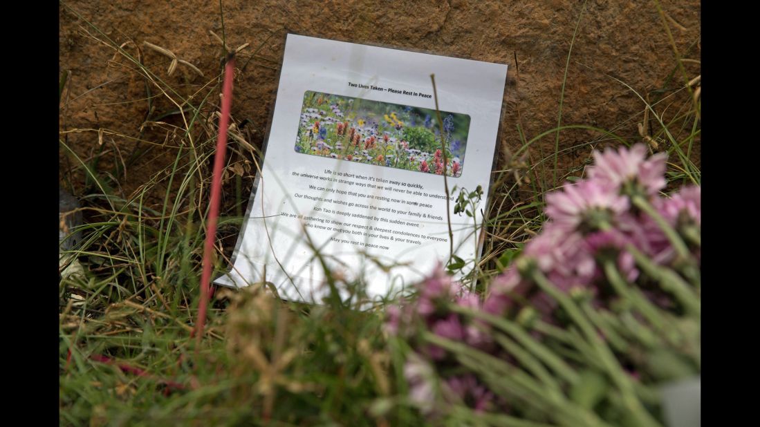 A tribute and flowers sit near the spot where the couple was found.