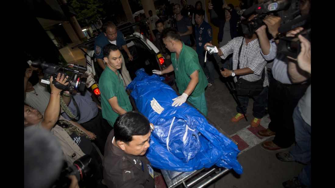 Miller's body is carried to a forensic police facility in Bangkok on Tuesday, September 16.