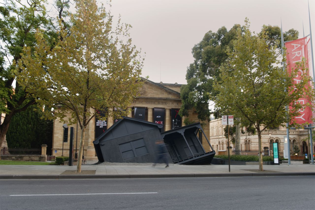 <em>Landed </em>by <em>Ian Strange</em><br /><br />Despite first impressions, this gothic-style house did not fall from the sky. In fact, "Landed" is a site-specific installation that was constructed in front of the Art Gallery of South Australia as part of the 2014 Biennal of Australian art. The house was actually a recreation of the artist's home in Australia. <br /><br />It's the magical space "between the possible and the impossible" that truly steers the future, says Feireiss. "It's a space and place where the future can be discussed before it happens. Artistic invention happens through such imagination."  