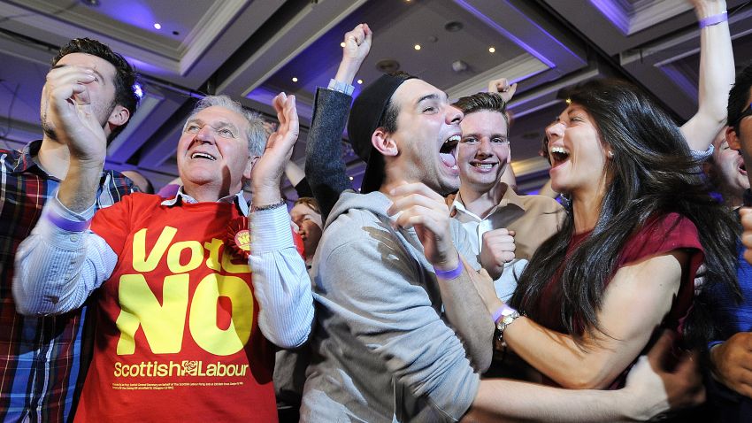 Pro-union supporters celebrate as Scottish independence referendum results are announced at a 'Better Together' event in Glasgow, Scotland, on September 19, 2014.