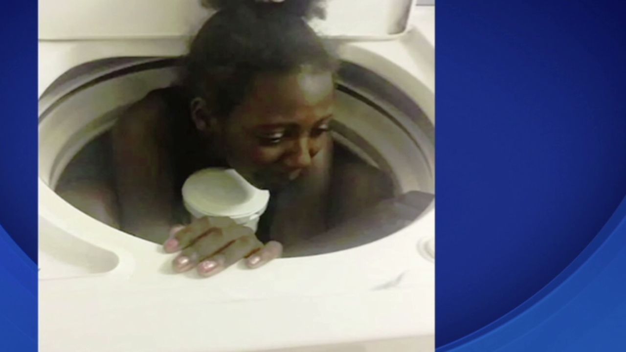 Girl gets stuck in washing machine