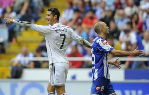 Cristiano Ronaldo celebrates after scoring one of Real Madrid's eight goals against Deportivo la Coruna at the Municipal de Riazor stadium. 
