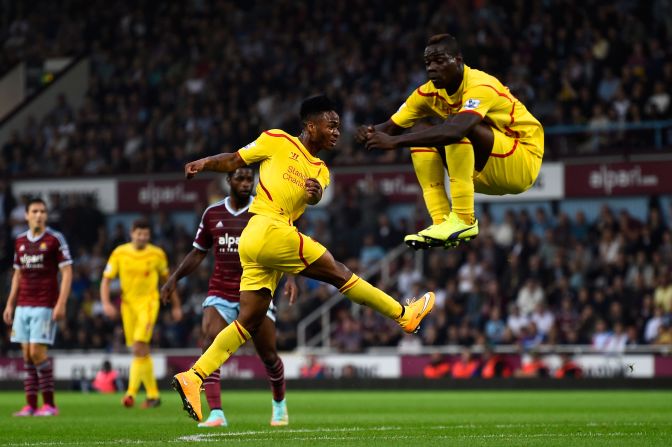 Raheem Sterling pulled a goal back before halftime as teammate Balotelli takes evasive action.