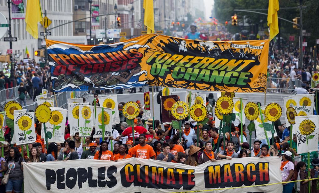 People gather near Columbus Circle before the People's Climate March in New York on Sunday, September 21. People from around the world are participating in what's billed as the largest march ever calling for action on global warming.