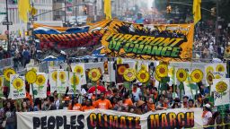 People gather near Columbus Circle before the People's Climate March in New York Sunday, September 21.  People from around the world are participating in what's billed as the largest march ever calling for action on global warming.