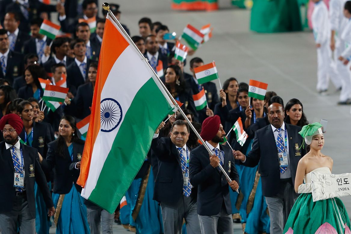 Shardar Singh of India carries his country's flag into the stadium on September 19.