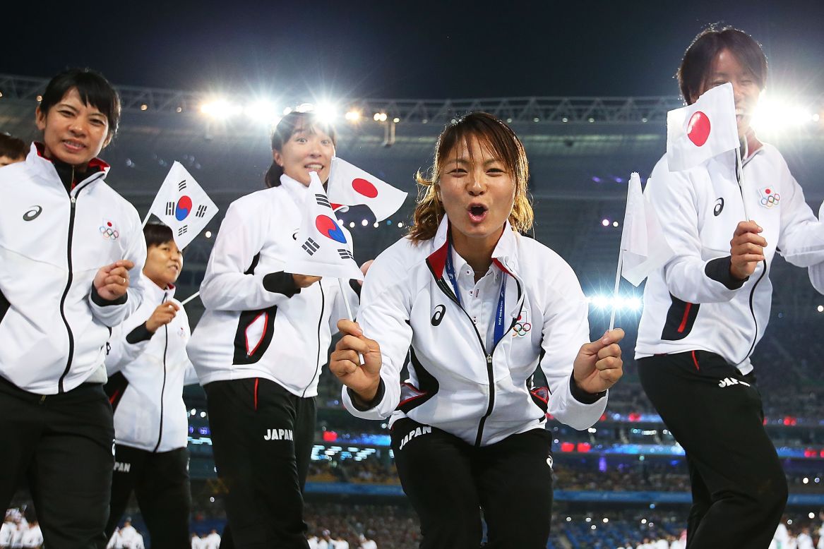 Excited athletes from Japan march at the start of the Asian Games in Incheon, September 19.