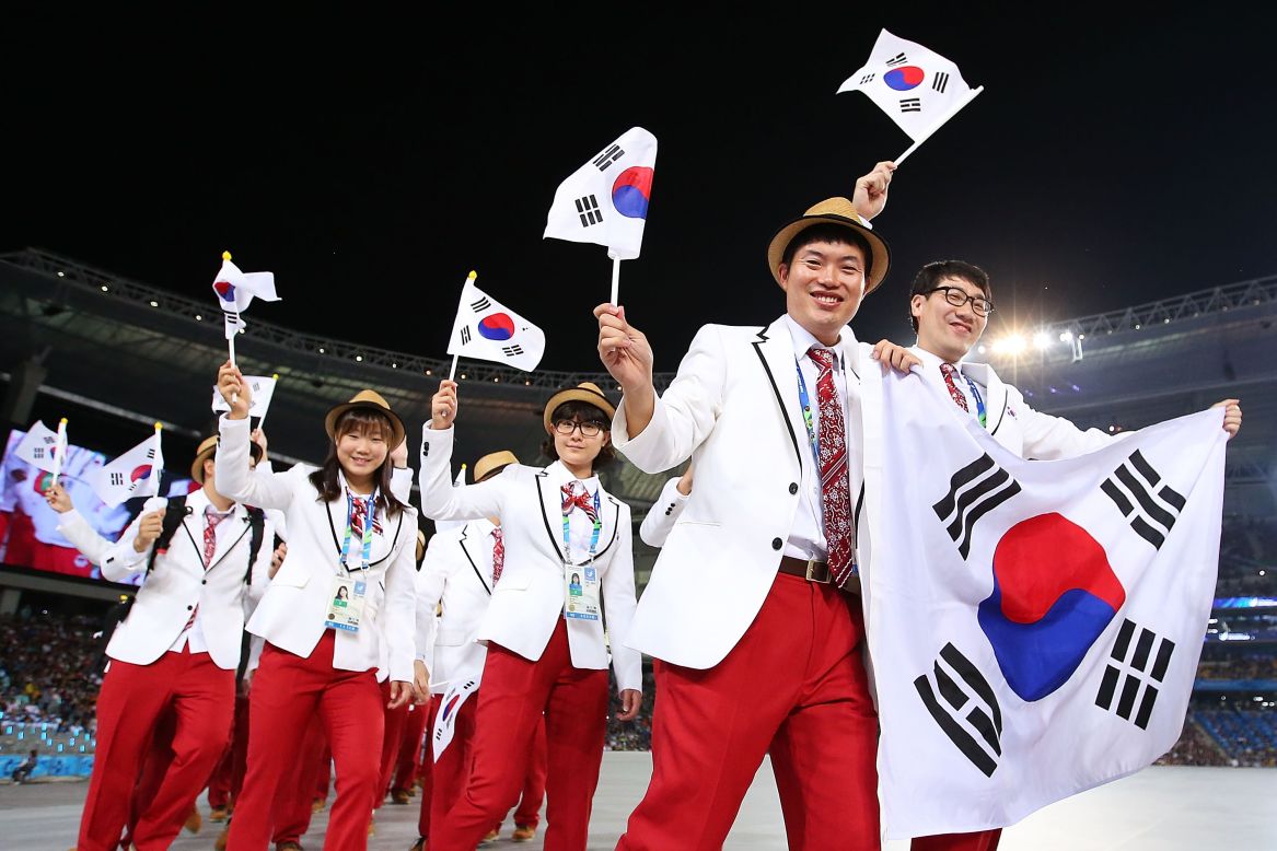 Waving flags, competitors from host country South Korea entered the stadium during the Opening Ceremony of the Asian Games, September 19.