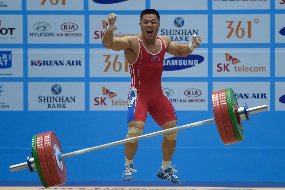 North Korea's Kim Un-Guk celebrates after winning the men's 62 kilogram weightlifting event and breaking a world record at the 17th Asian Games on September 21.
