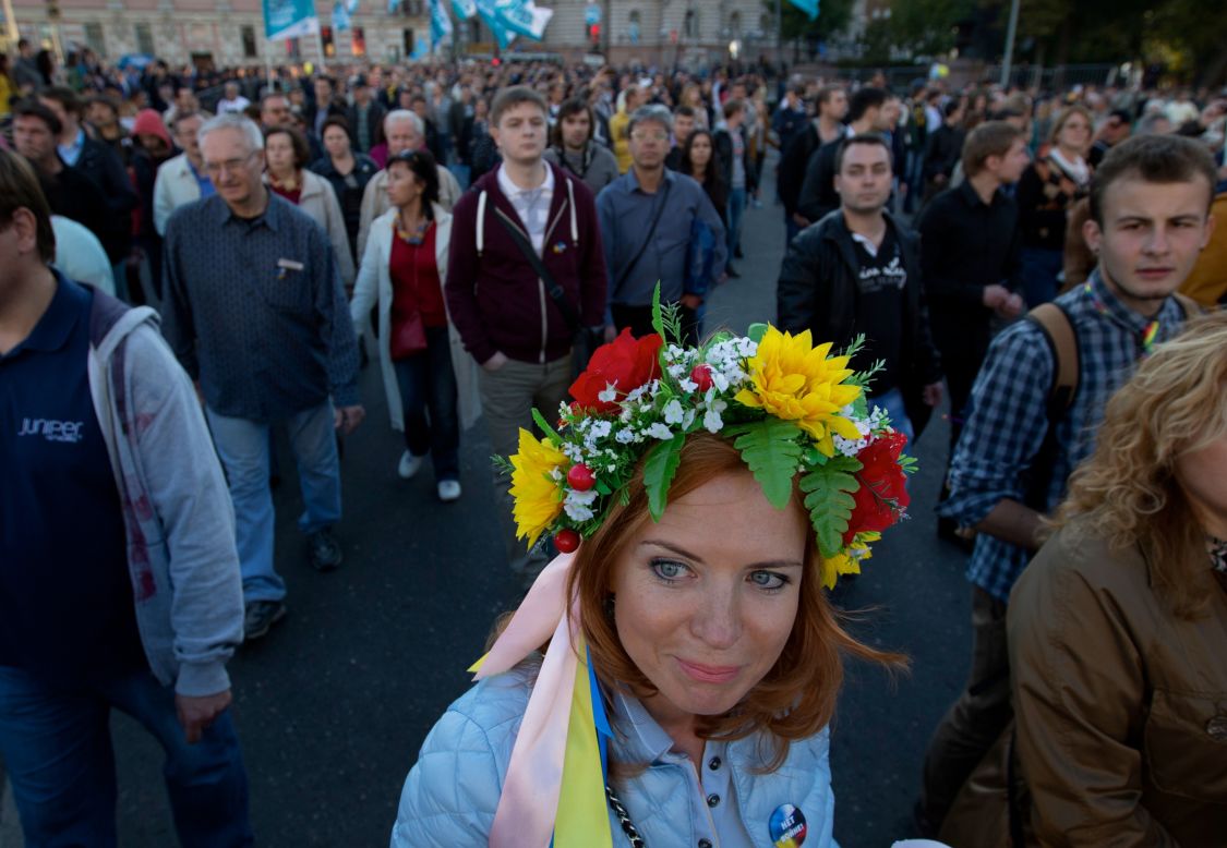 SEPTEMBER  22 - MOSCOW, RUSSIA: A protester wears traditional Ukrainian flower headband during an anti-war rally in Moscow. Several thousand people took to the streets of the Russian capital to protest the war in Ukraine and how Kremlin has handled the crisis there.