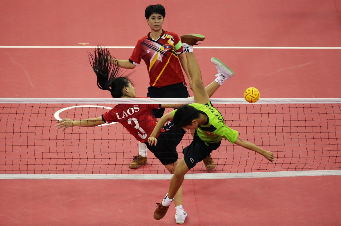 Competitors in action during the Sepaktakraw Women's Double Final. It's otherwise known as "kick volleyball" because players can only use their feet, knee, chest and head to touch the ball. Here players from Laos take on the Burmese team on September 22. Myanmar won.