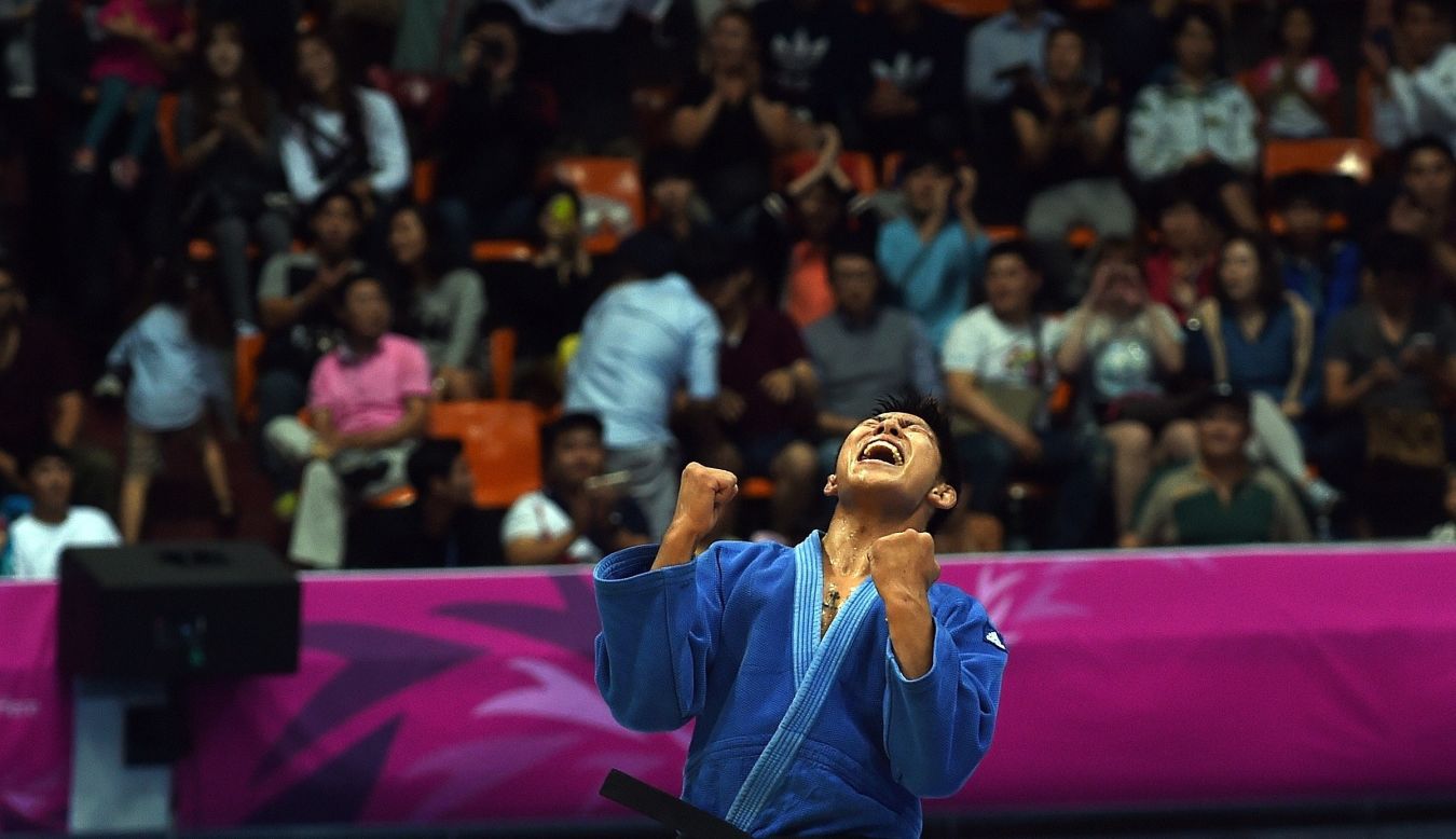 South Korea's Kim Jaebum celebrates after defeating Lebanon's Nacif Elias in the men's 81kg judo final on September 21.