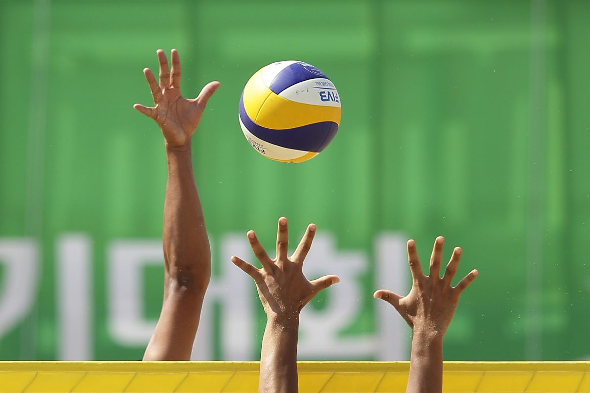 It's mine! Lee Heeyoon of South Korea and Shiunaz Abdul Waahid of Maldives challenge for the ball during the Men's Beach Volleyball Preliminary Round at the 2014 Asian Games, September 22.