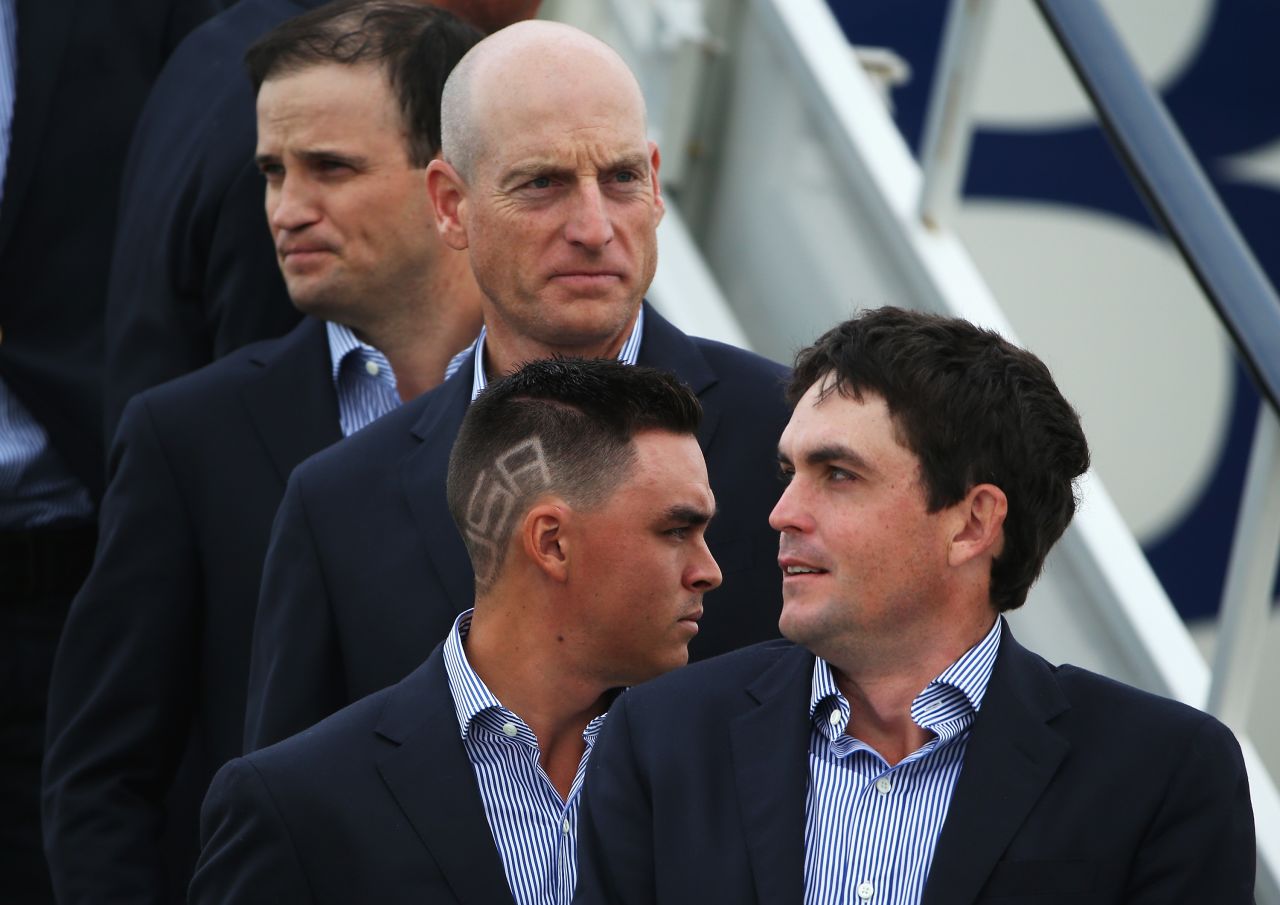 Fowler's haircut certainly ensured he stood out from the crowd as he touched down at Edinburgh Airport with teammates Keegan Bradley (front), Jim Furyk (center) and Zach Johnson (rear.)