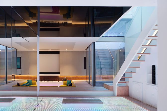 <a href="http://www.hogartharchitects.co.uk/" target="_blank" target="_blank">Hogarth Architects</a>-designed Hidden House's huge finished basement, light-up dance floor and waterfall were featured on the British homes show "Grand Designs."
