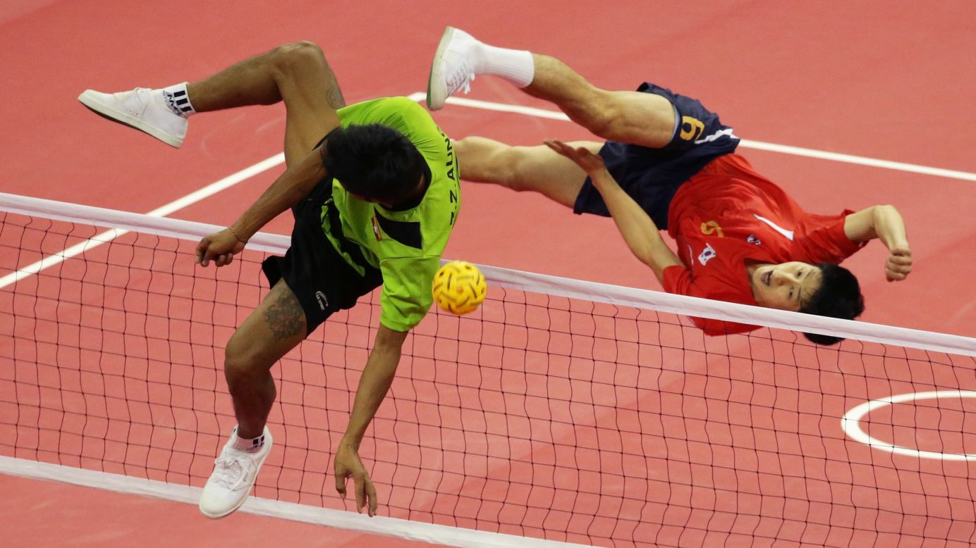 South Korea's Kim Young-man, right, and Myanmar's Zaw Zaw Aung compete for a ball Monday, September 22, during a sepak takraw match at the Asian Games in Incheon, South Korea. Zaw Zaw Aung teamed with Wai Lin Aung and Zaw Latt to win the men's doubles final in sepak takraw, which is sort of like volleyball using your feet.