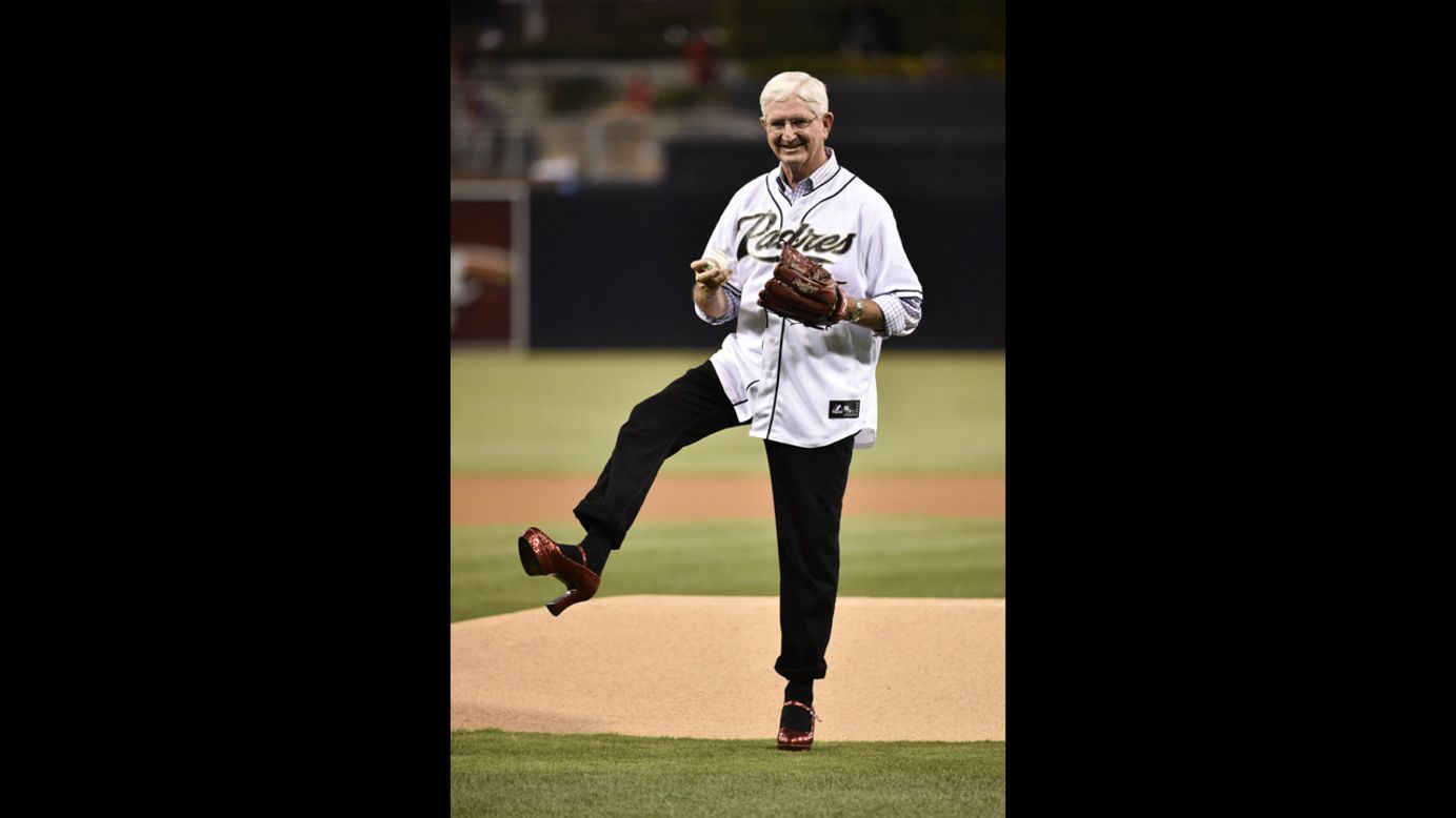 San Diego County Sheriff Bill Gore stands in front of the mound at San Diego's Petco Park to throw out the ceremonial first pitch before a baseball game Wednesday, September 17, between the Philadelphia Phillies and the San Diego Padres. Gore was wearing red heels to promote awareness of domestic violence. 