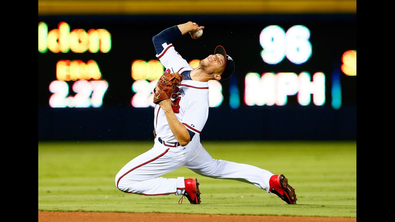 Atlanta Braves shortstop Andrelton Simmons tries to throw out a New York Mets player during a baseball game played Friday, September 19, in Atlanta.