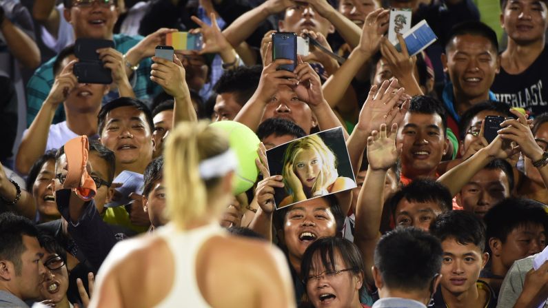 Fans cheer tennis player Maria Sharapova on Monday, September 22, after she defeated Svetlana Kuznetsova at the Wuhan Open in Wuhan, China.