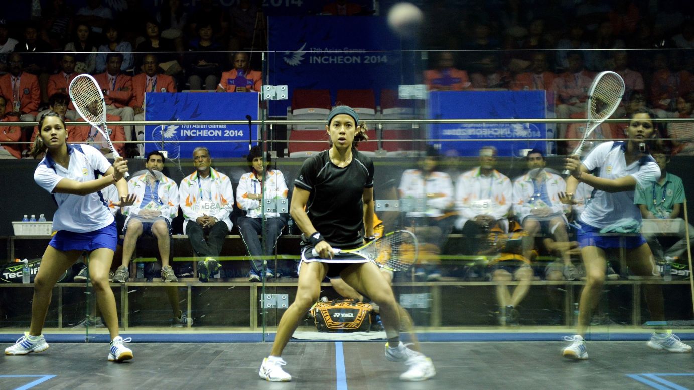 The reflection of Indian squash player Dipika Pallikal is seen on the wall during her Asian Games semifinal match against Malaysia's Nicol Ann David on Monday, September 22. David won and advanced to the gold-medal match.