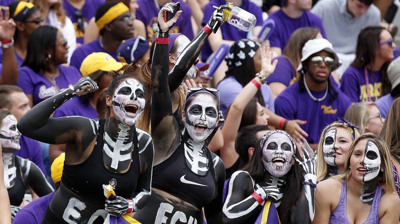 Fans of the East Carolina football team cheer on their Pirates before a home game Saturday, September 20, in Greenville, North Carolina. East Carolina trounced the visiting North Carolina Tar Heels 70-41.