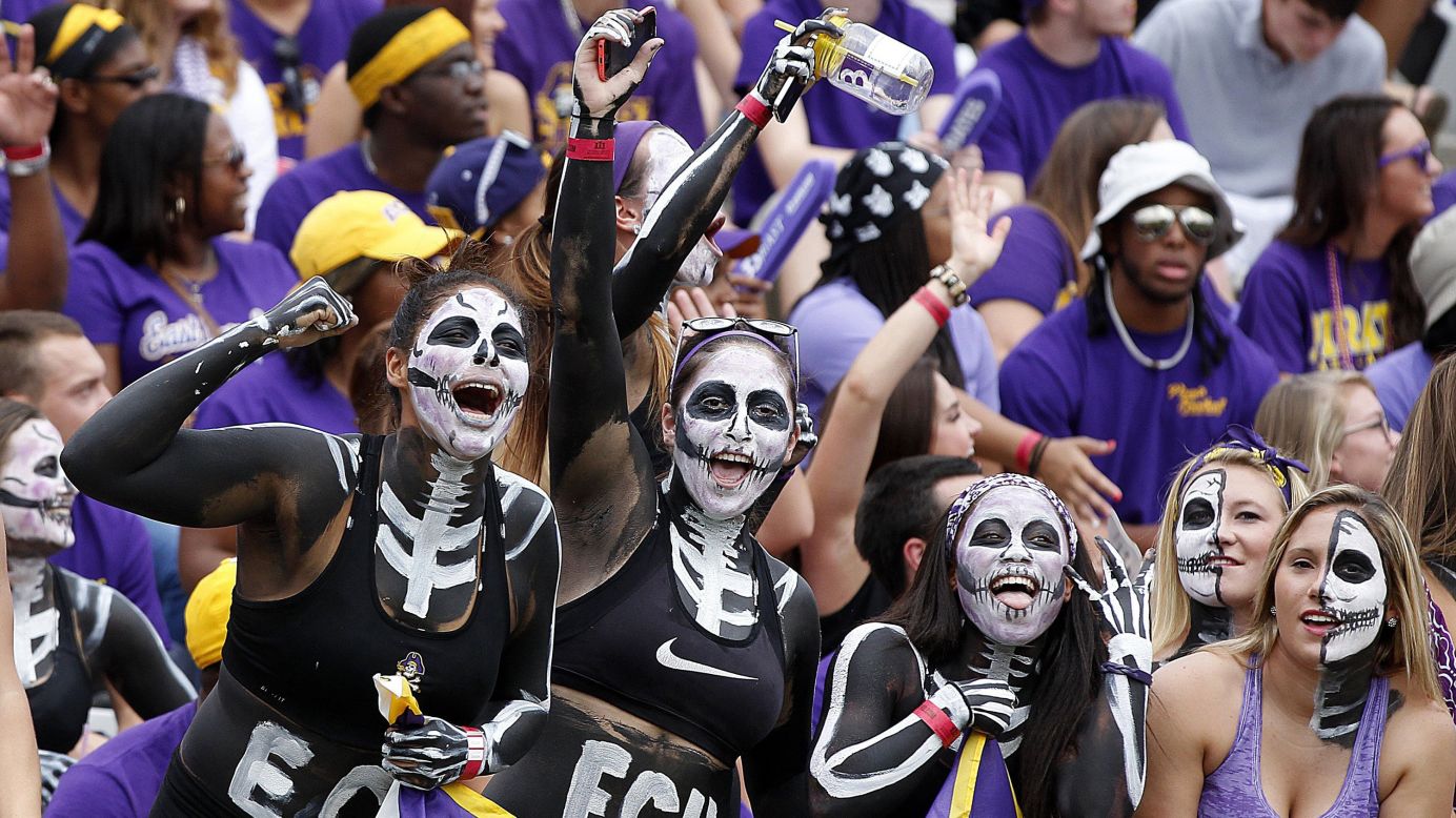 Fans of the East Carolina football team cheer on their Pirates before a home game Saturday, September 20, in Greenville, North Carolina. East Carolina trounced the visiting North Carolina Tar Heels 70-41.
