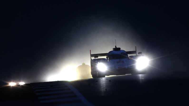 The Audi driven by team members Marcel Fassler, Andre Lotterer and Benoit Treluyer races at night Saturday, September 20, during the FIA World Endurance Championship event held in Austin, Texas.