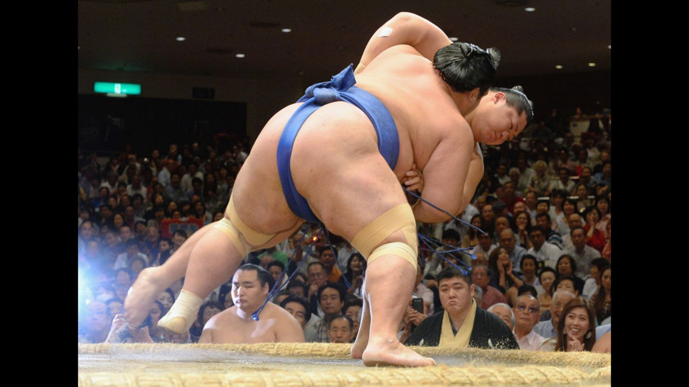 Kotoshogiku, front, pushes Endo to win a match on Wednesday, September 17 — Day 4 of the Grand Sumo Autumn Tournament in Tokyo.